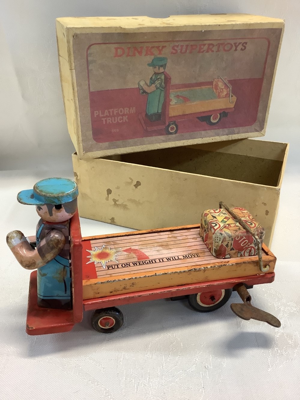 Jouet en tôle Dinky Supertoys, avec sa boîte et sa clef, fonctionnel, en l’état 2 monnaies jouet en tole dinky supertoys avec sa boite et sa clef fonctionnel en l etat
