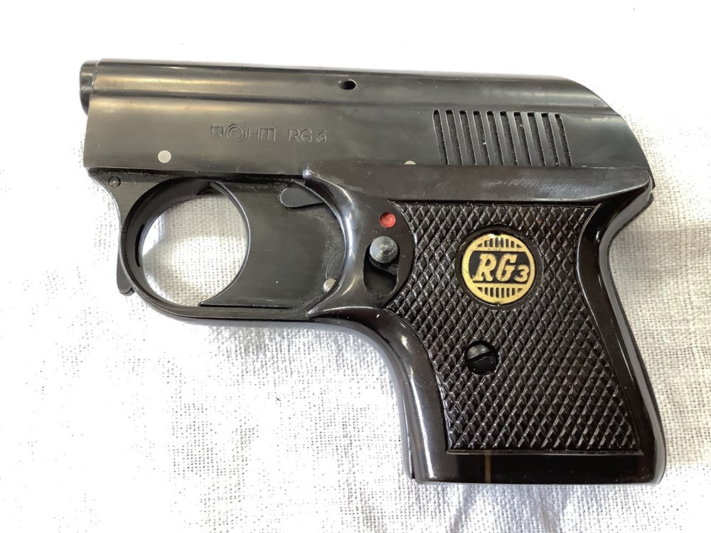 Un pistolet d’alarme Rohm RG3, dans sa boîte 2 monnaies un pistolet d alarme rohm rg3 dans sa boite