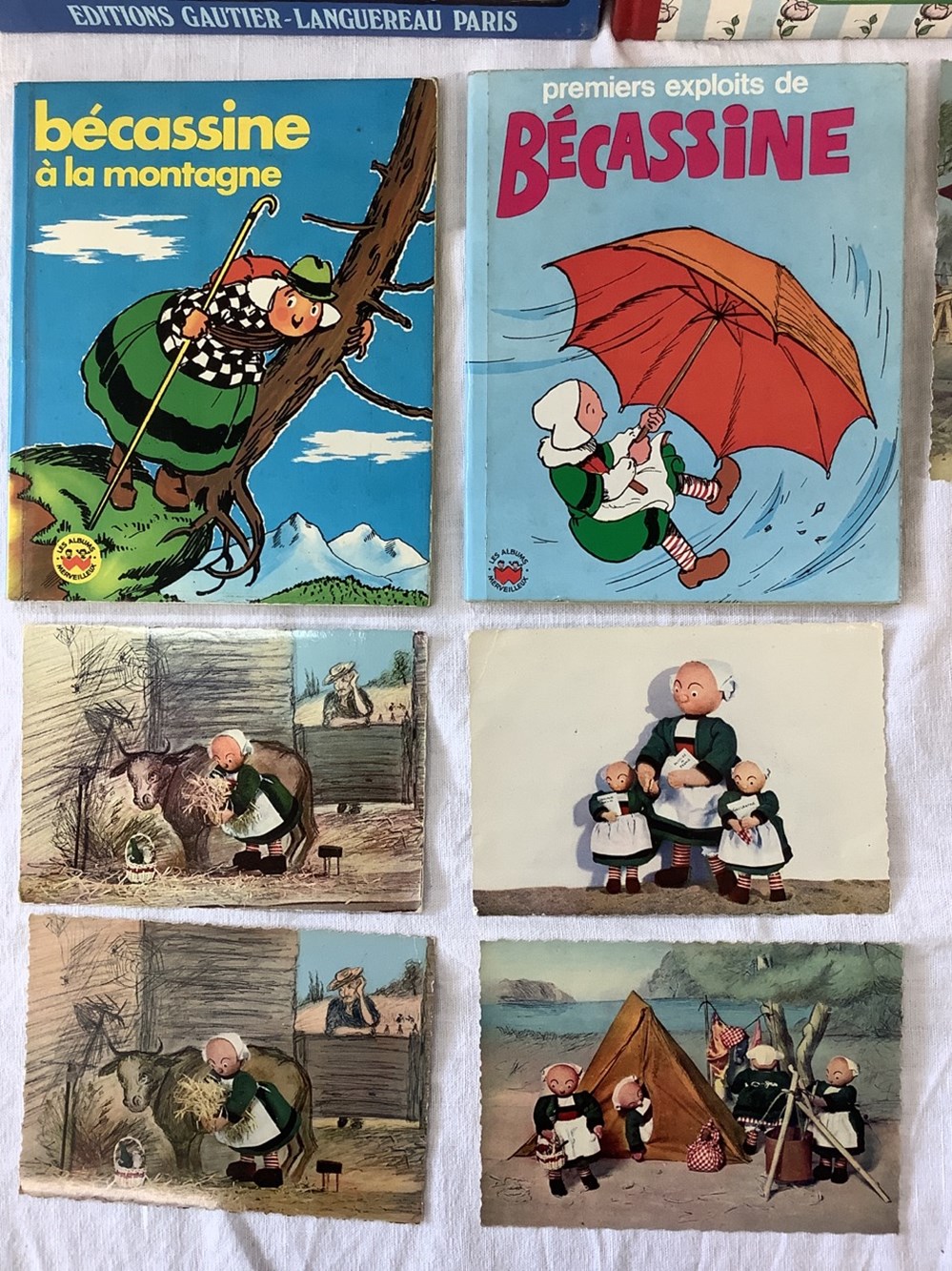 Lot Bécassine, dont 3 rééditions, 2 petits livres enfant 1969 et 5 cartes postales, les BD sont non déchirées, non crayonnées 2 monnaies lot becassine dont 3 reeditions 2 petits livres enfant 1969 et 5 cartes postales les bd sont non dechirees non crayonnees