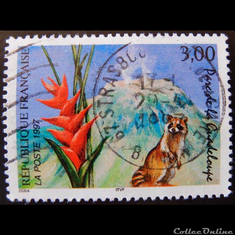 03055 Parc de la Guadeloupe Le volcan de la soufrière, le raton laveur et le balisier 3F timbre france 03055 parc de la guadeloupe le volcan de la soufriere le raton laveur et le balisier 3f