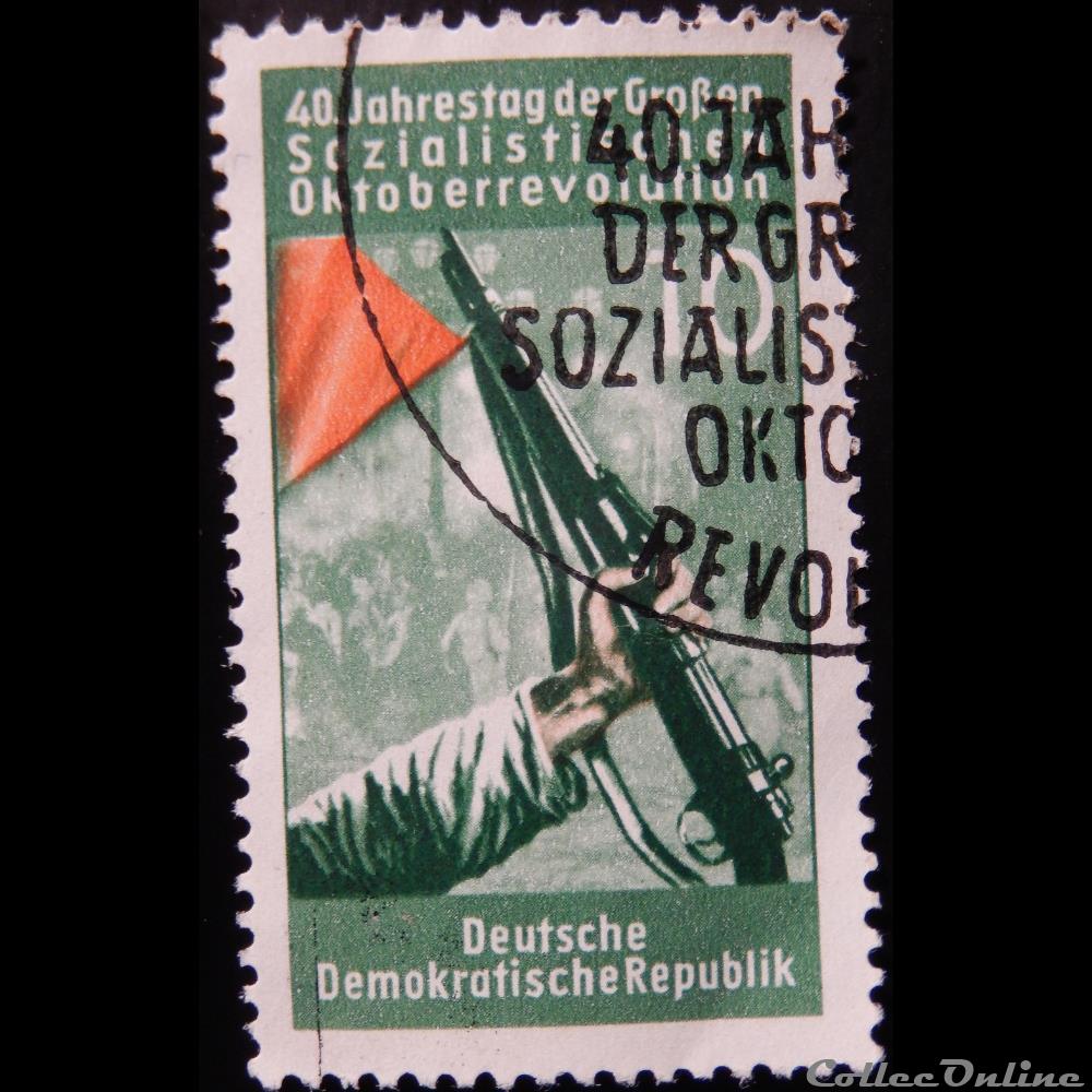 timbre europe allemagne rda 00329 fusil et drapeau rouge 10pf de 1957