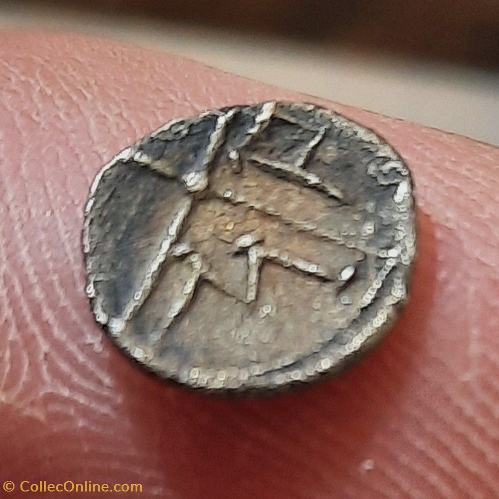 Imitation Obole des Salyens A/Tete indigene a d R/ Roue a 4 rayons -75-25 D9 P0.44g Feugere OBP 1-2 monnaies antiquite av jc ap gauloises imitation obole des salyens a tete indigene a d r roue a 4 rayons 75 25 d9 p0 44g feugere obp 1 2