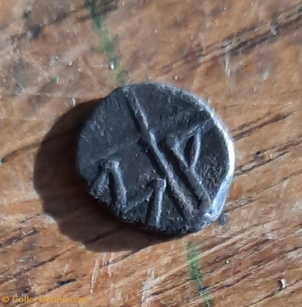 monnaie antique jc gauloise marseille obole a teteapollon a g r roue avec rayons 100 50 d9 p 0 56g feugere obm 11b