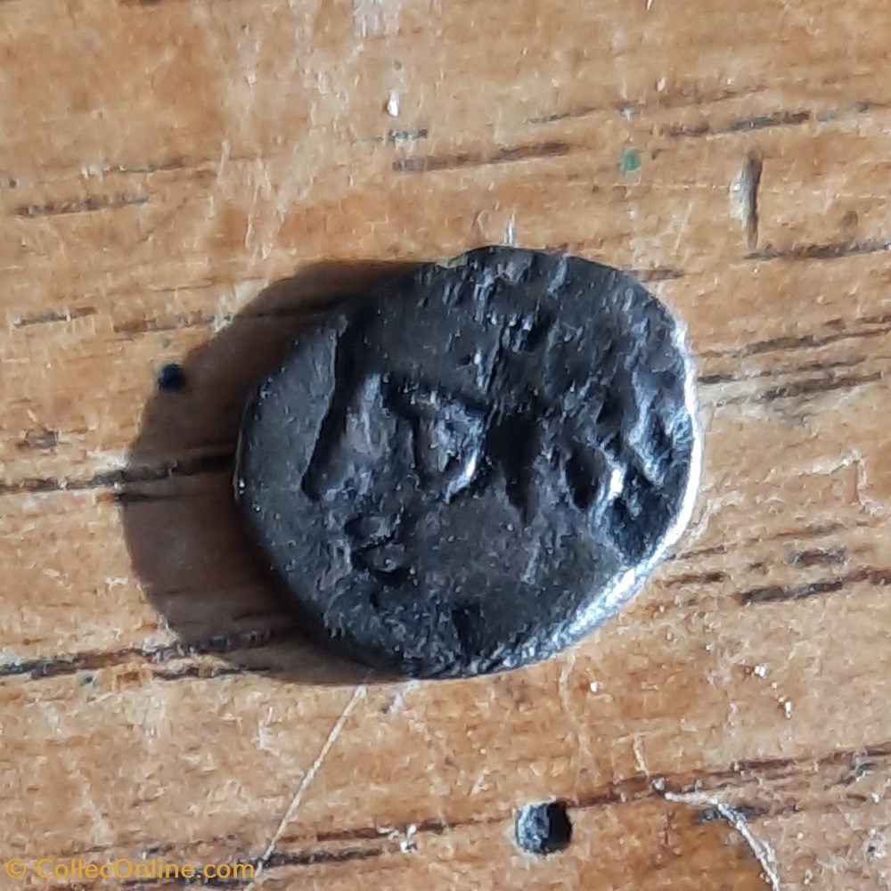 monnaie antique jc gauloise marseille obole a teteapollon a g r roue avec rayons 100 50 d9 p 0 56g feugere obm 11b