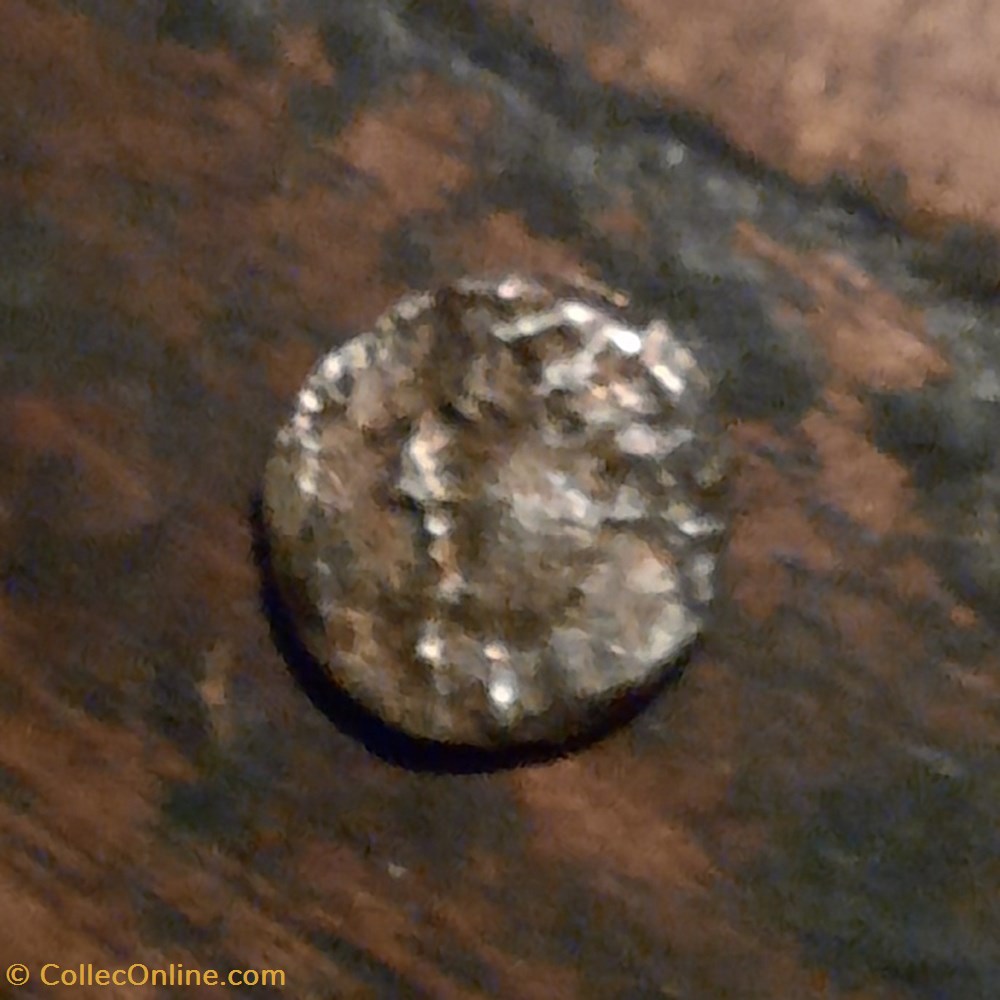 Obole Volques Arecomiques A/Tete a g N sous le menton R/Roue MA -75-25 D8.4 P0.36g Feugere OBV-2B monnaie antique av jc ap obole volques arecomiques a tete a g n sous le menton r roue ma 75 25 d8 4 p0 36g feugere obv 2b