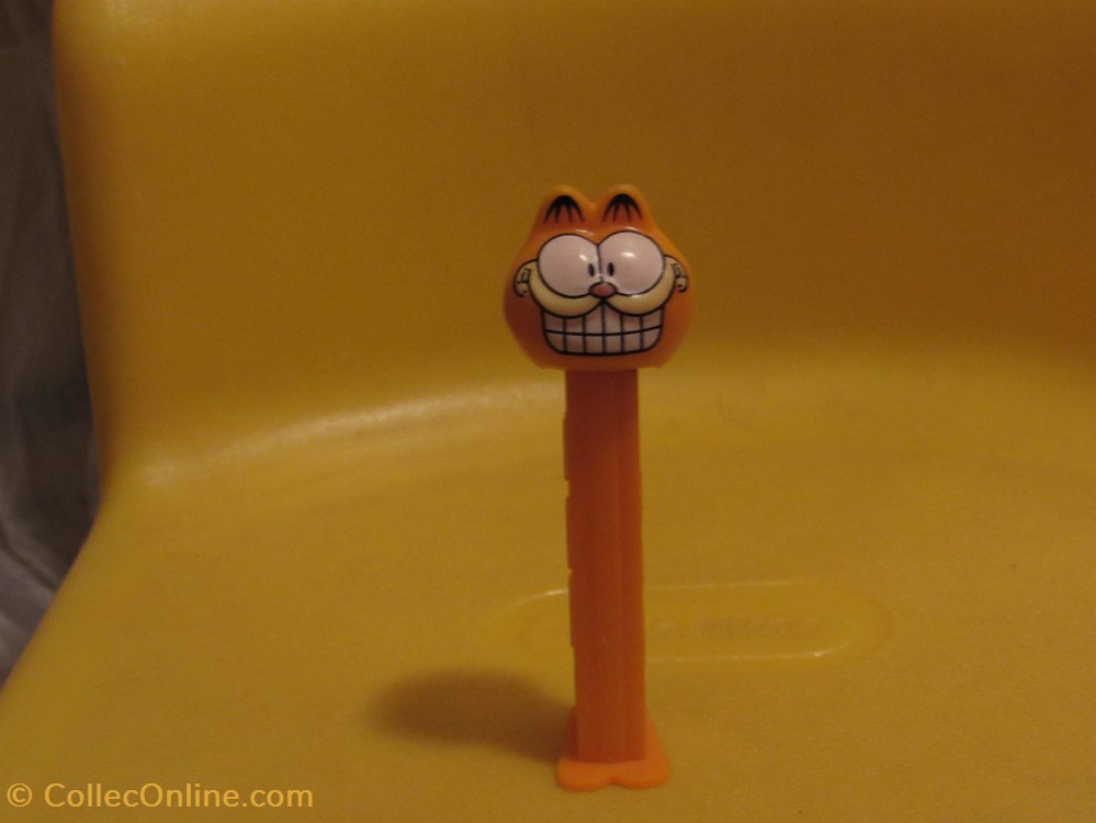 Garfield Cheesy Grin Pez Dispenser board games toys garfield cheesy grin pez dispenser