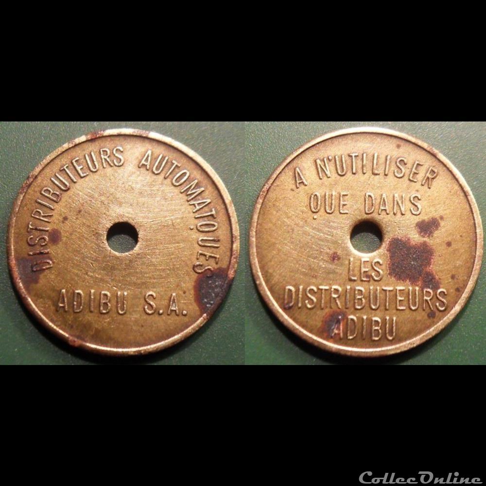 b- Jeton Distributeurs automatiques ADIBU S.A. variante fautée monnaies paranumismatique jetons poids b jeton distributeurs automatiques adibu s a variante fautee