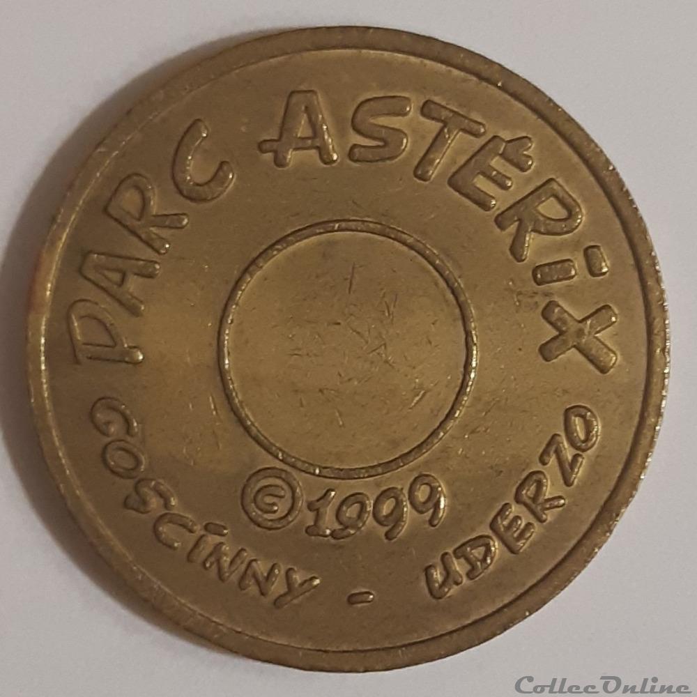 medaille parc asterix jeton machine dore
