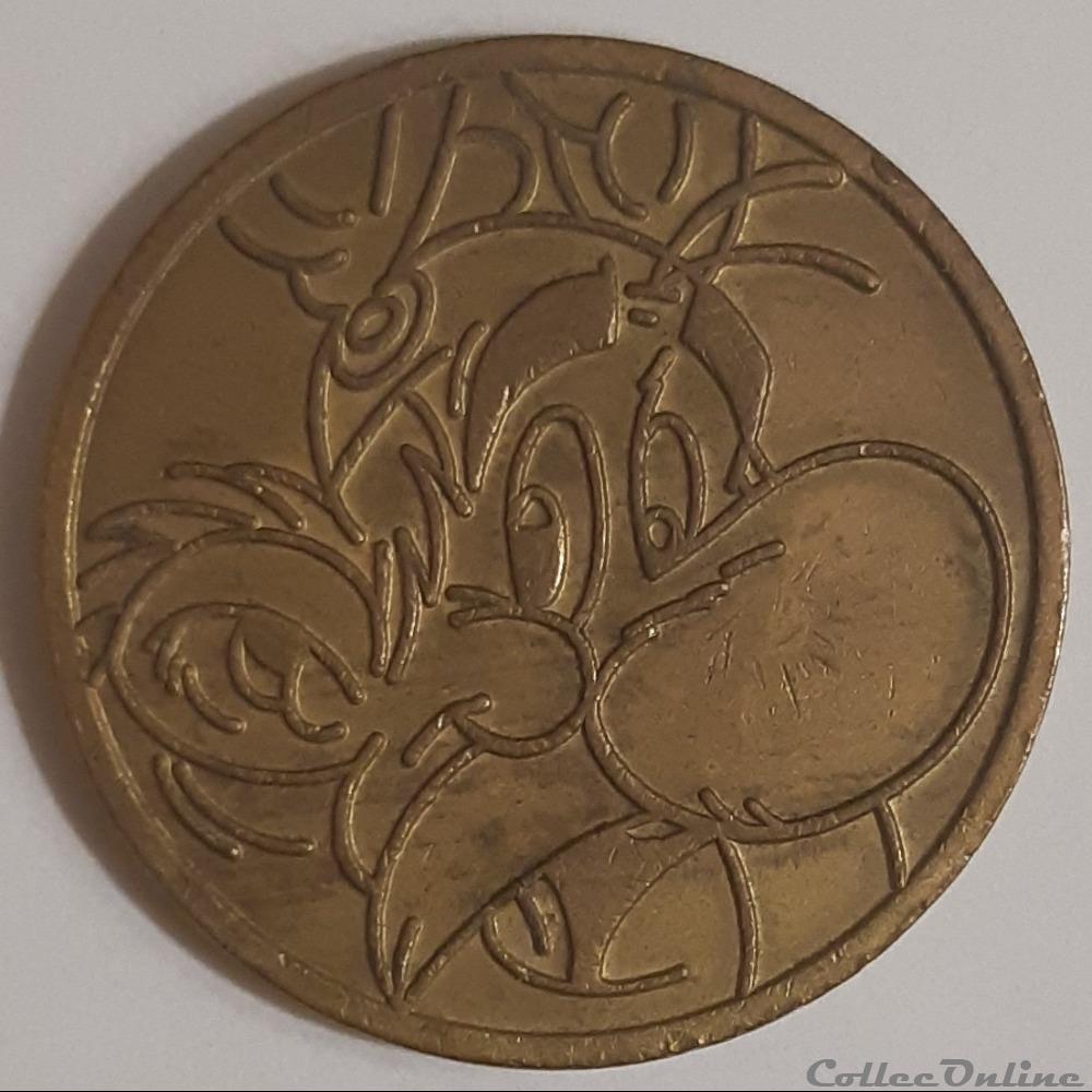 medaille parc asterix jeton machine dore