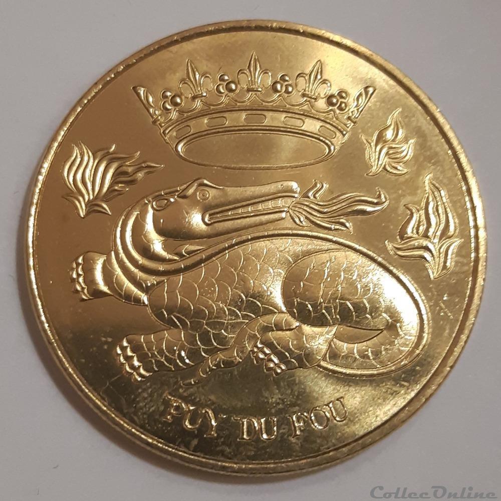medaille puy du fou dragon et couronne