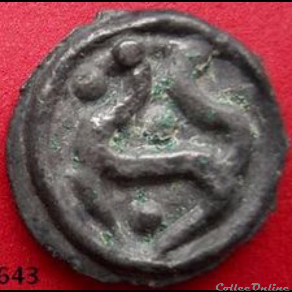Série 559 DT 2643 Potin à la tête d'indien stylisé/ annelet pointé monnaie antique gauloise serie 559 dt 2643 potin a la tete indien stylise annelet pointe