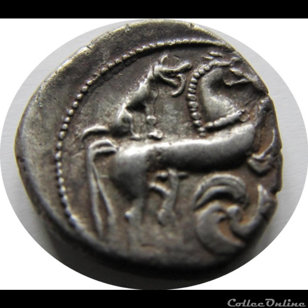 Série 1040 DT 3362 Drachme au loup et au triskele monnaie antique gauloise serie 1040 dt 3362 drachme au loup et au triskele