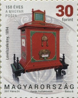 Post box with an emptying mechanism