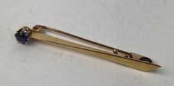 Brosch, 18k guld, syntetisk sten