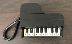 Téléphone Piano noir Comoc Communications, 1988.