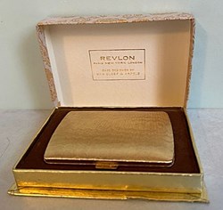 Poudrier doré REVLON dans sa boite