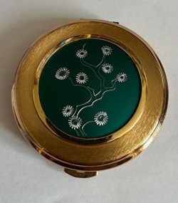 Poudrier rondvdécors fleurs sur fon vert