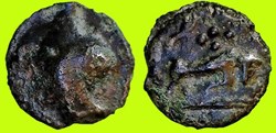 potin au taureau chargeant et aux quatre globules