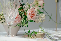 peach-roses-on-table-with-glass