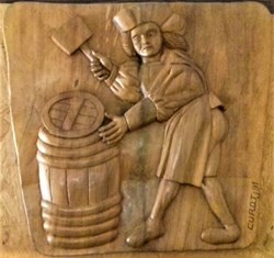 Tonnelier plaçant un fond sur une barrique