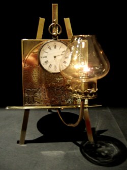 Porte montre avec lampe à essence