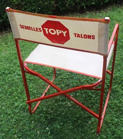 Fauteuil pliant publicitaire, TOPY, semelles, talons.