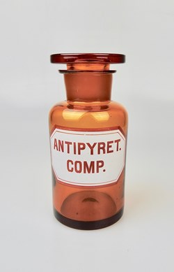 Flacon de pharmacie en verre ambré moyen modèle à étiquette blanche et rouge