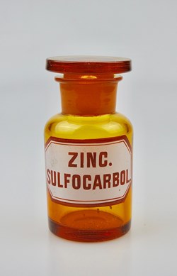 Flacon de pharmacie en verre ambré petit modèle à étiquette blanche et rouge