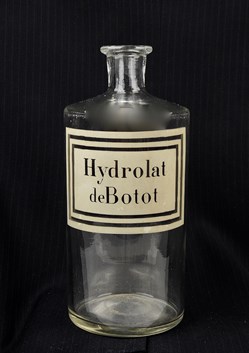 Flacon en verre grand modèle étiquette blanche sans couvercle Pharmacie RAVASSE