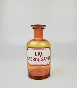 Flacon de pharmacie en verre ambré moyen modèle à étiquette blanche et rouge, forme bouteille