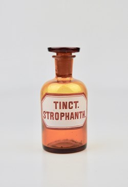 Flacon de pharmacie en verre ambré moyen modèle à étiquette blanche et rouge, forme bouteille