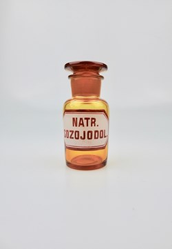 Flacon de pharmacie en verre ambré très petit modèle à étiquette blanche et rouge