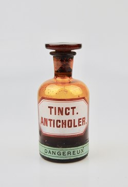 Flacon de pharmacie en verre ambré moyen modèle à étiquette blanche et rouge, forme bouteille