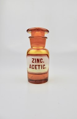 Flacon de pharmacie en verre ambré très petit modèle à étiquette blanche et touge