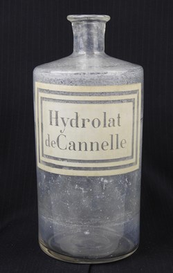 Flacon en verre grand modèle étiquette blanche sans couvercle Pharmacie RAVASSE