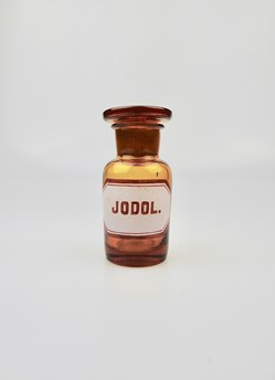 Flacon de pharmacie en verre ambré très petit modèle à étiquette blanche et rouge