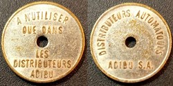 b- Jeton Distributeurs automatiques ADIBU S.A. fautée