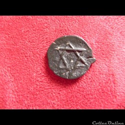 2 falus ??? ou fel sans date et une étoile sur chaque face