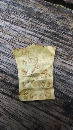 Ancient javanese burial urn in gold script