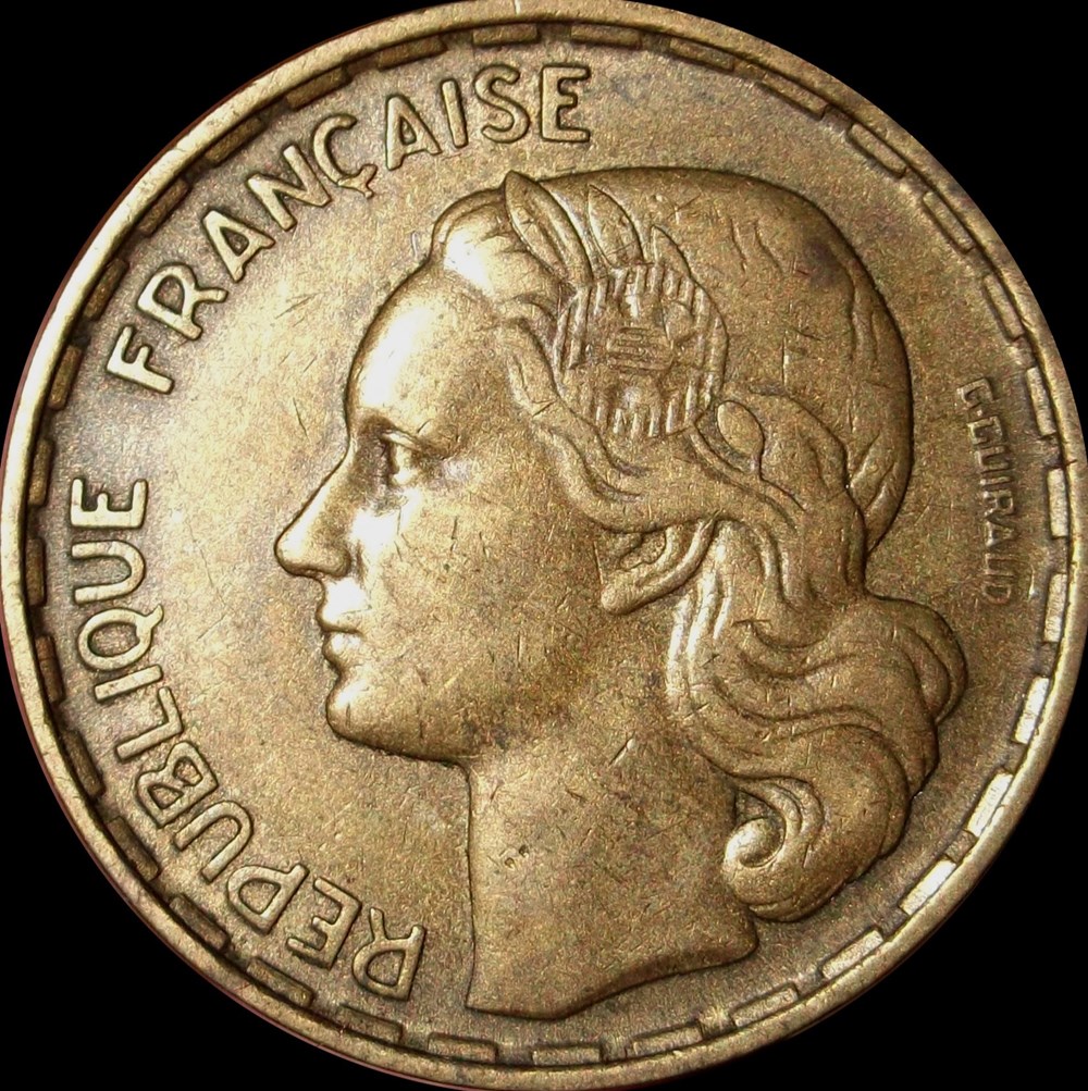 50 Francs Guiraud Avers Titulature avers : REPUBLIQUE FRANÇAISE. Description avers : tête de Marianne aux cheveux longs à gauche, couronnée d'une branche d'olivier portant fruit, ornée d'une cocarde tricolore (centre guilloché...